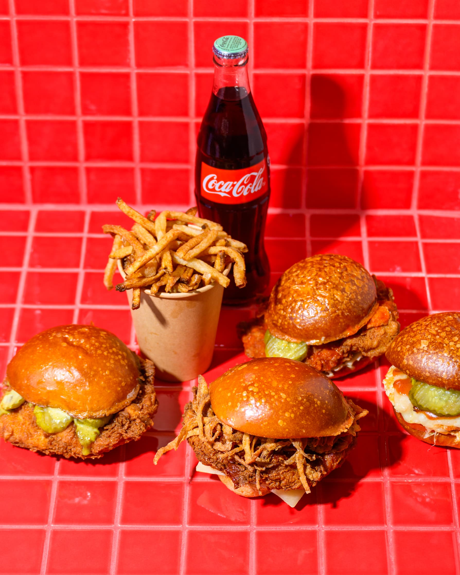 All Pluma sandwich options displayed alongside Coca-Cola