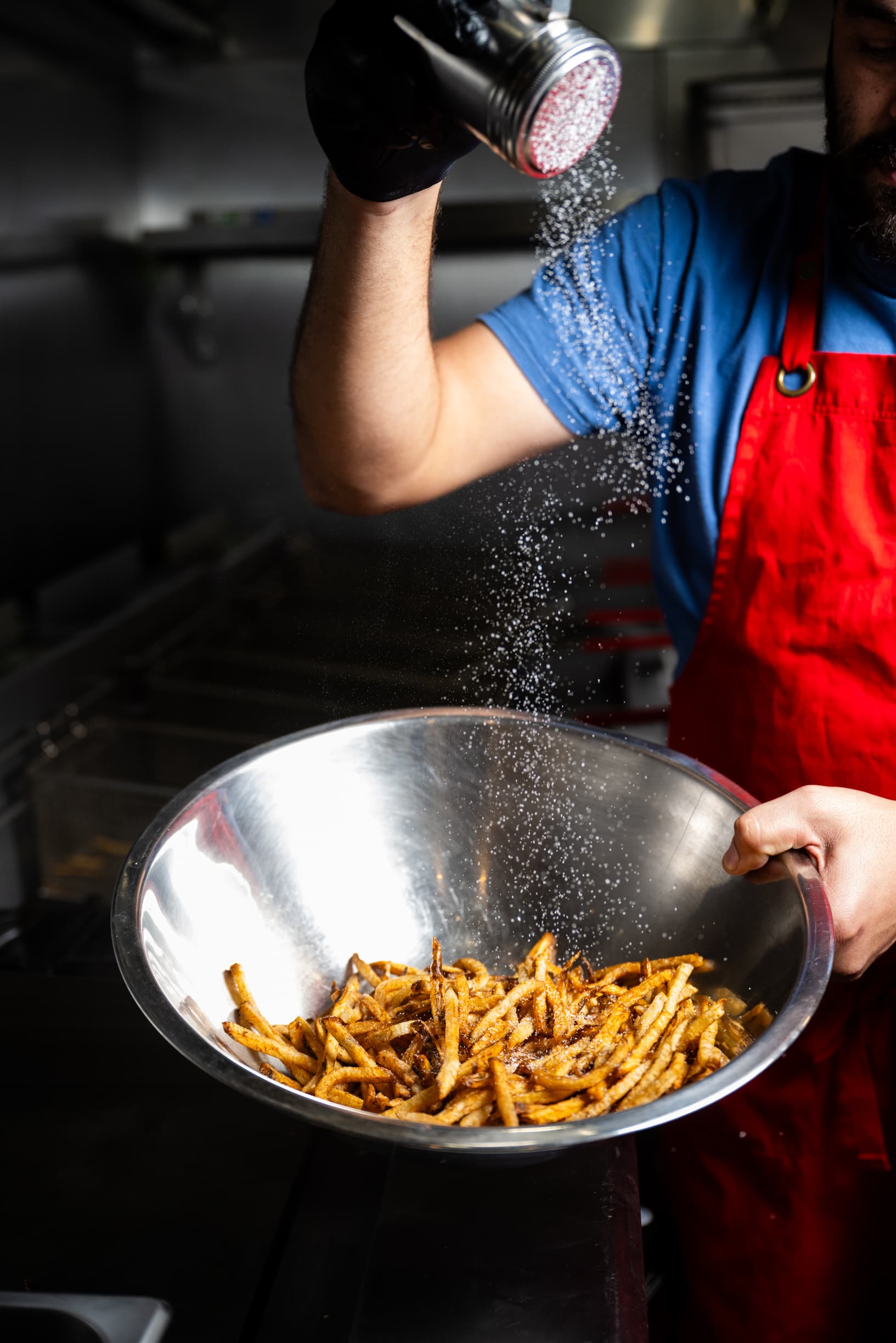 Cajun-seasoned beef tallow fries in a paper holder