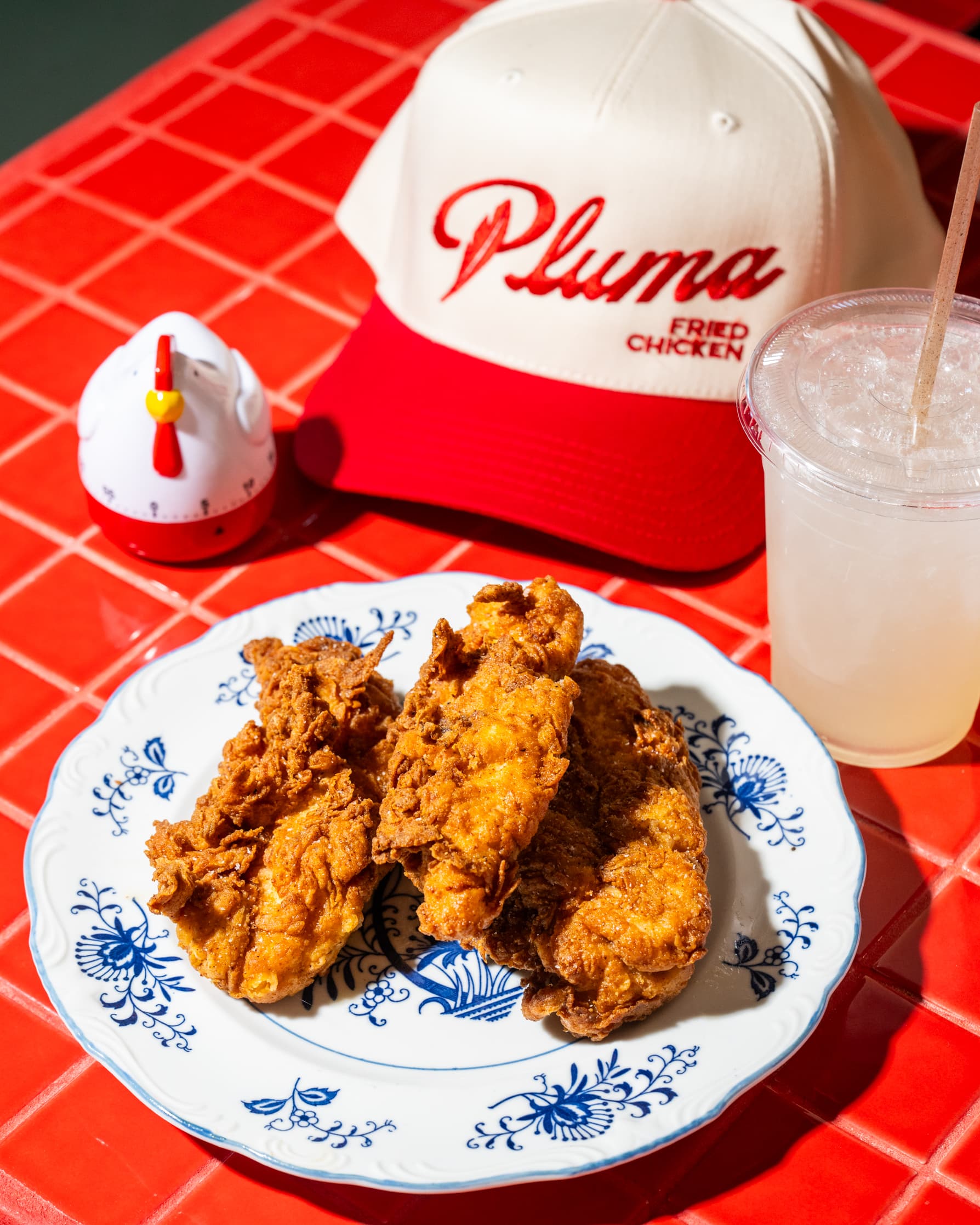 Fried chicken served on a plate at Pluma