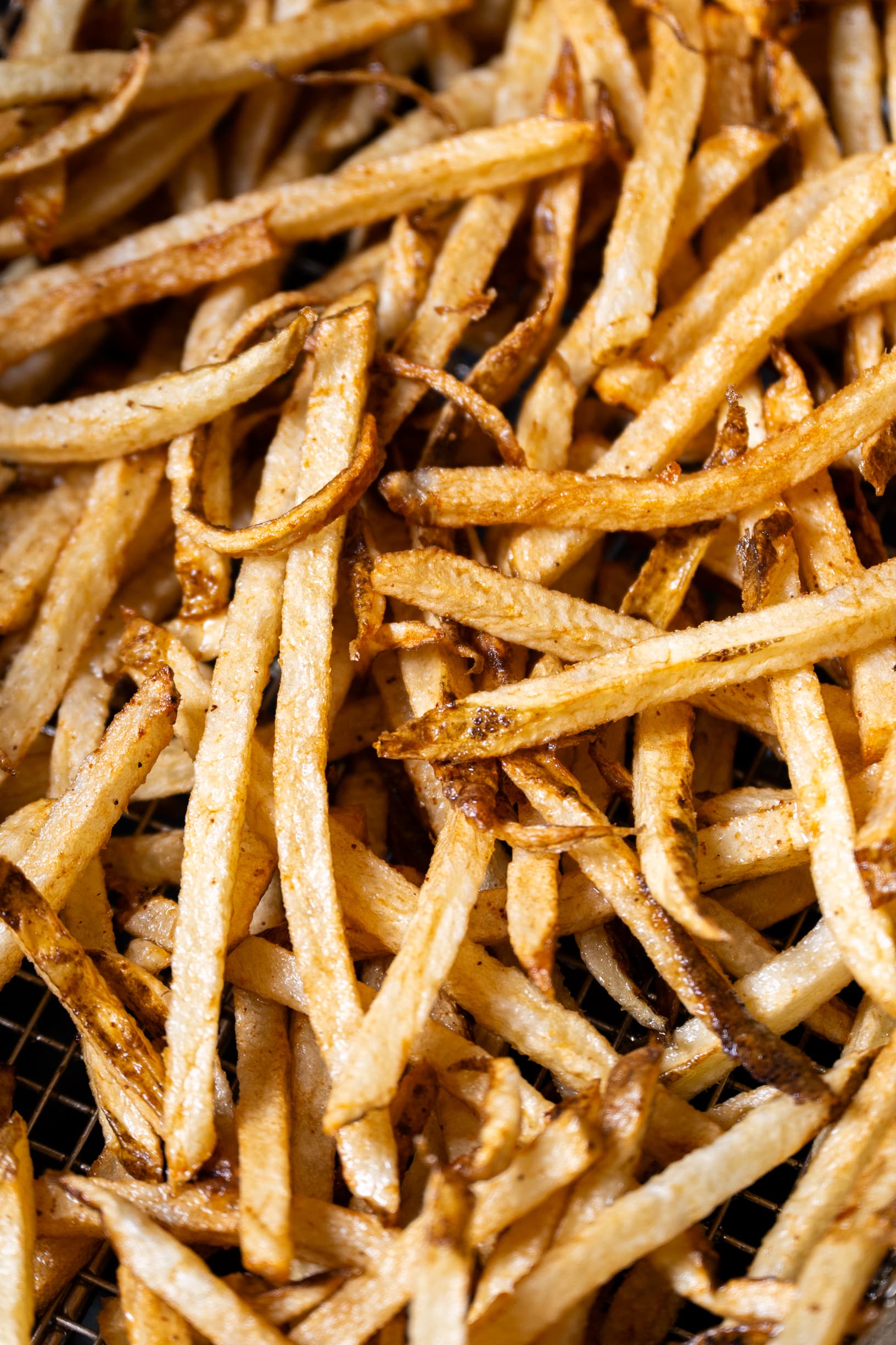 Close-up of golden beef tallow fries showing crispy texture