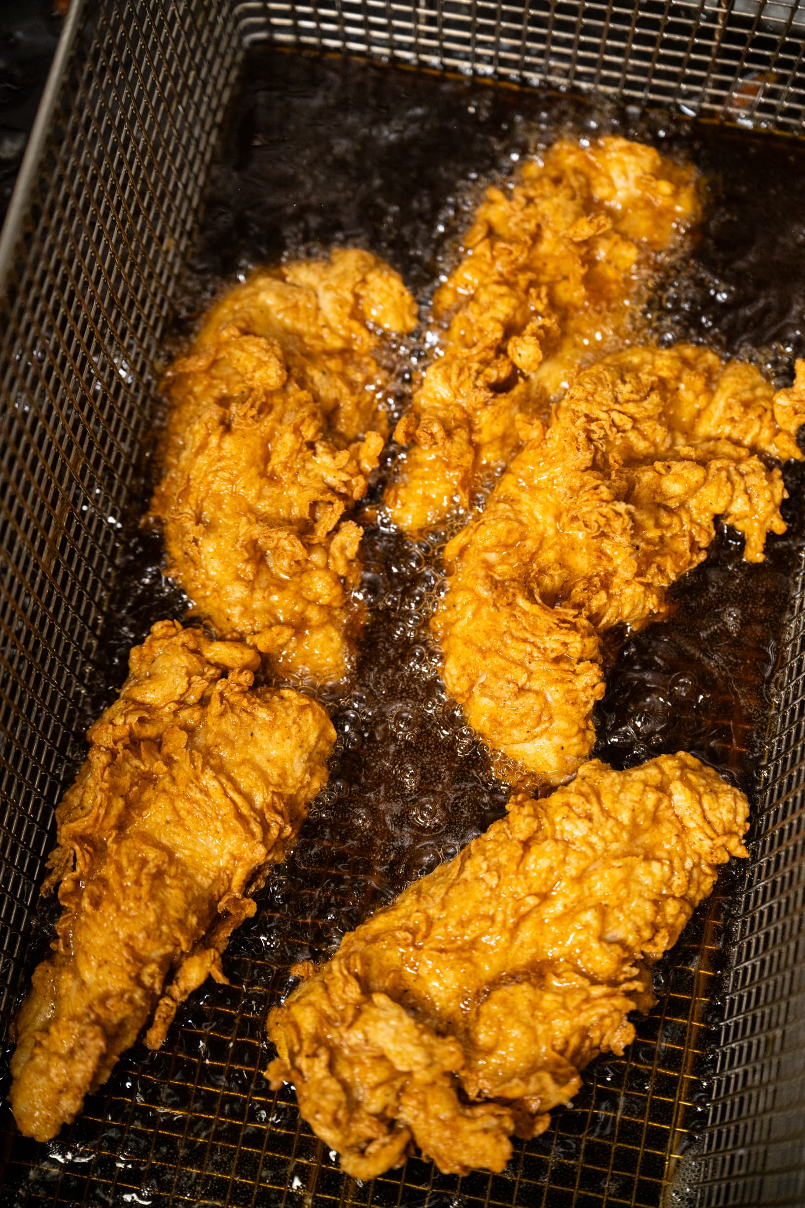 Deeply golden fried chicken fresh out of the fryer