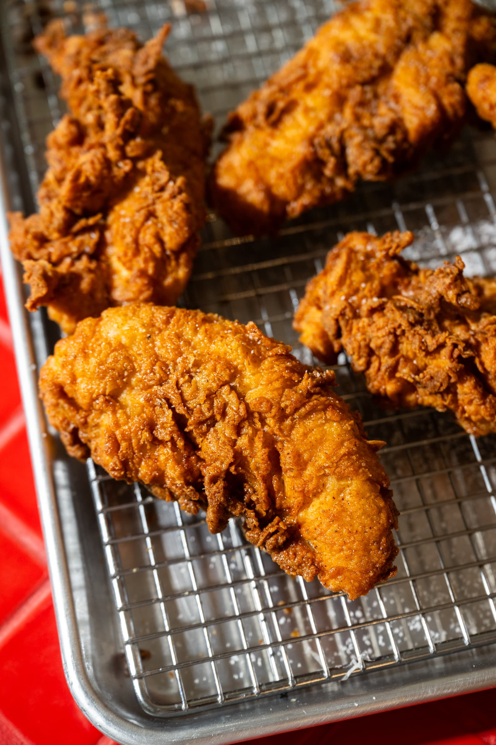 Second batch of golden fried chicken pieces, overhead view