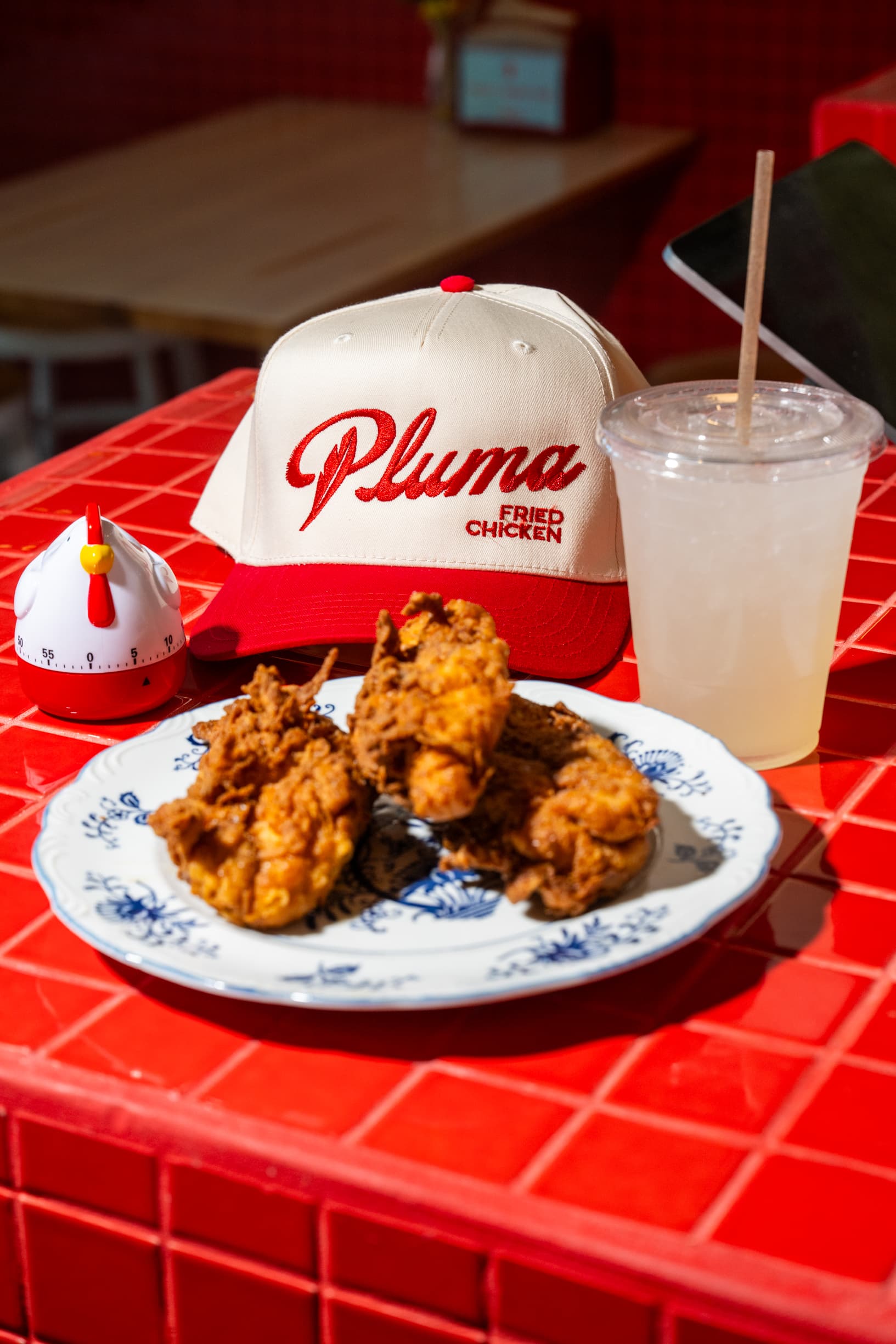 Complete Pluma meal with chicken, fries, and a drink